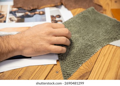 Person examining fabric texture