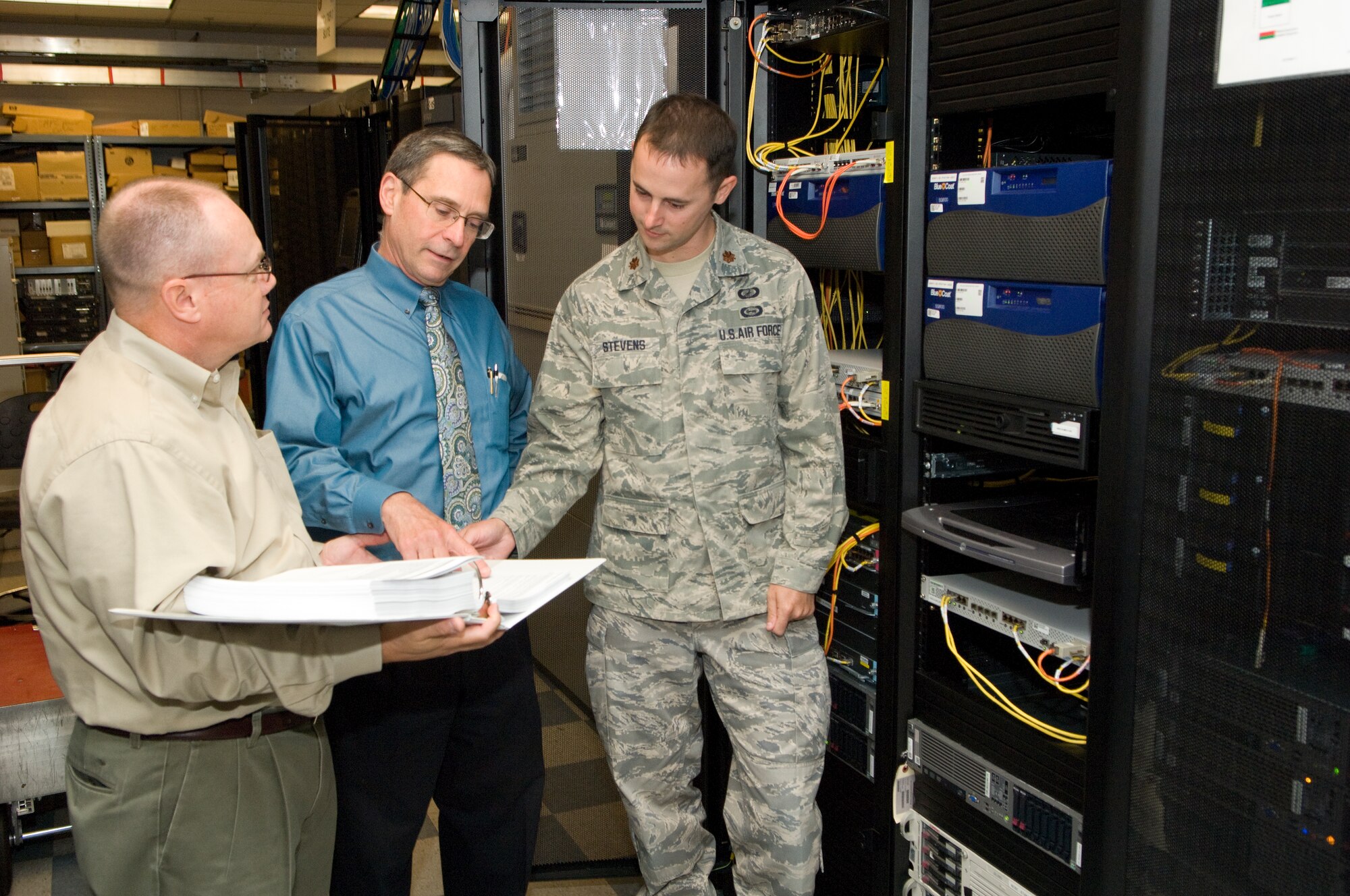 Team members in uniform discussing a project