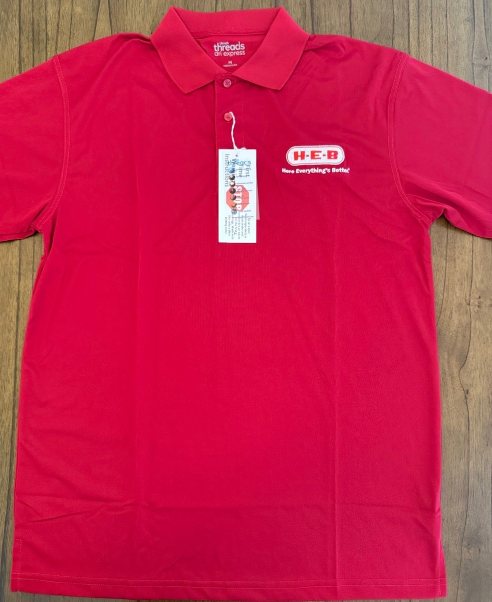 Employee trying on a uniform shirt