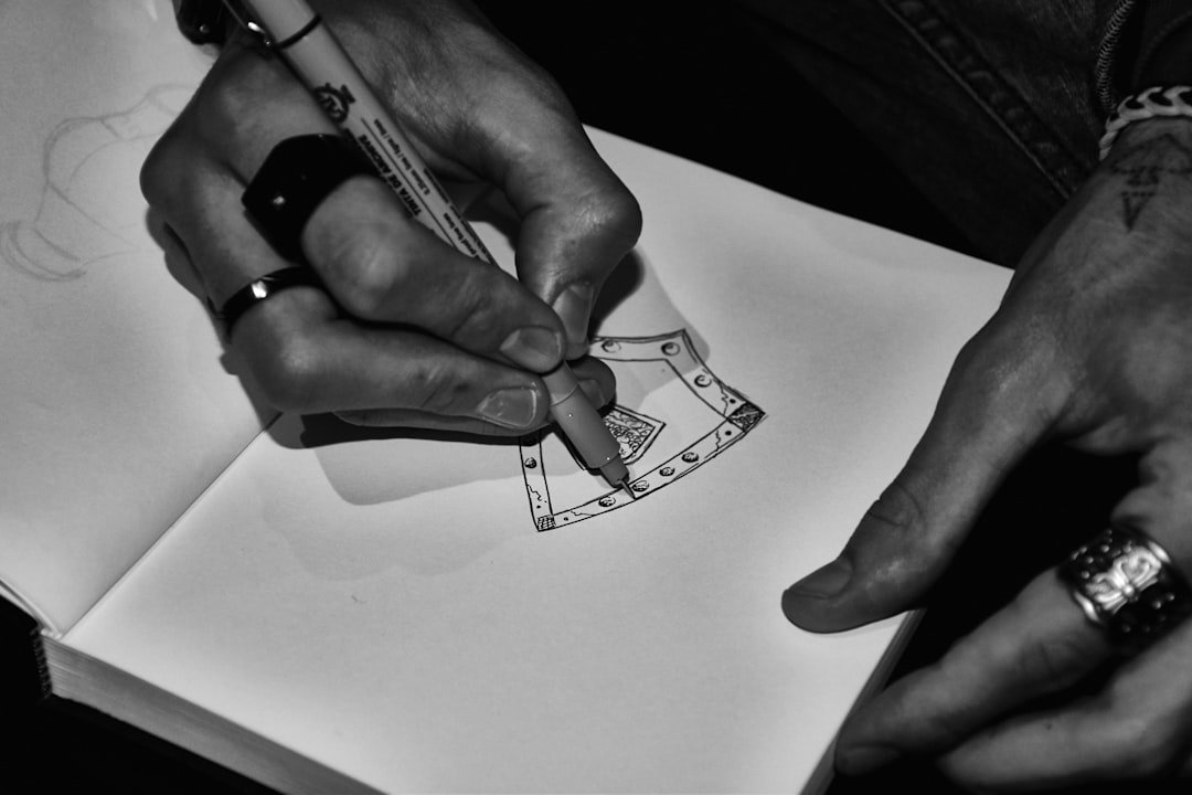 Hands folding a clean work tee