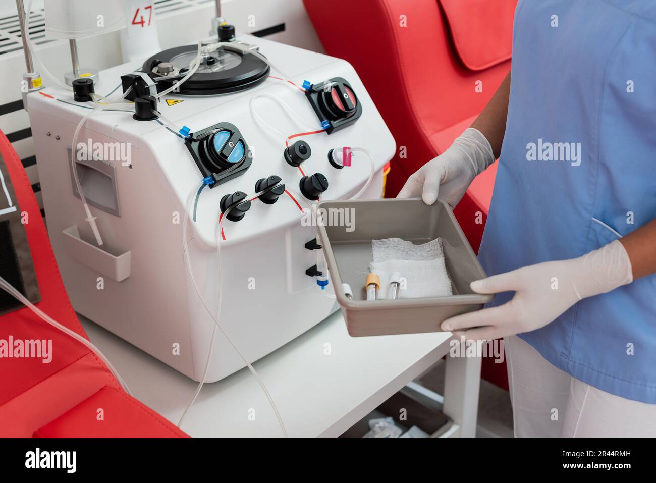 Healthcare worker in uniform checking equipment