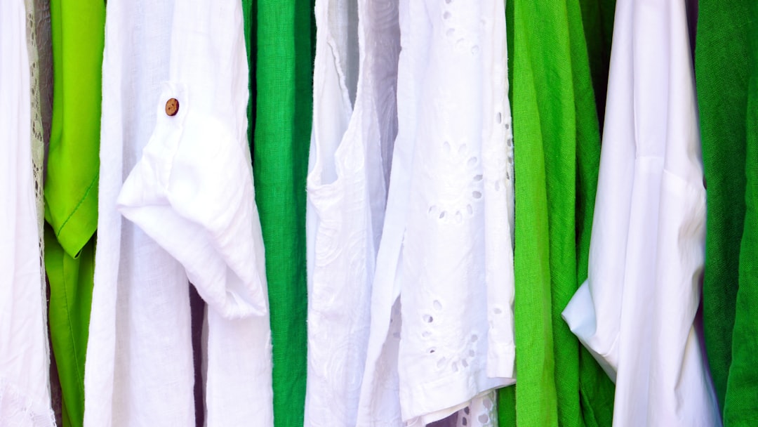 Office worker adjusting their uniform shirt