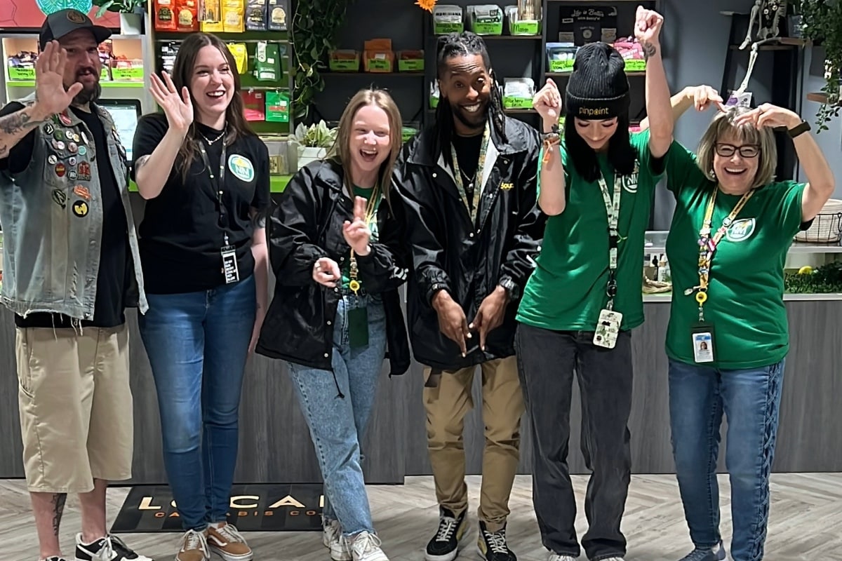 Team of workers wearing branded hoodies