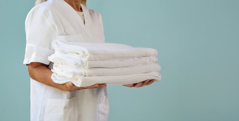 Employee neatly folding a uniform