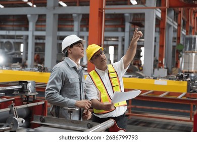 Supervisor discussing uniform with employee