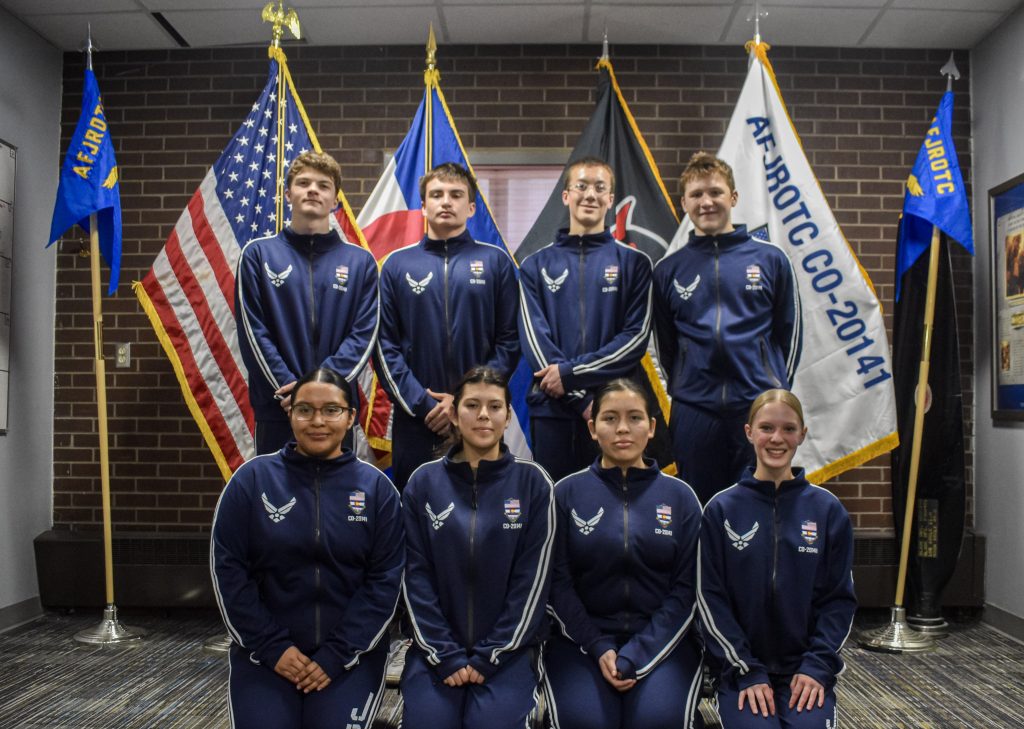 Team members in consistent uniforms